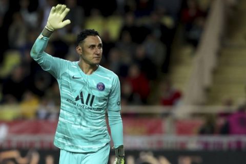 PSG's goalkeeper Keylor Navas gestures during the French League One soccer match between Monaco and Paris Saint-Germain at the Louis II stadium in Monaco, Wednesday, Jan. 15, 2019. (AP Photo/Daniel Cole)