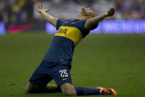 Boca Juniors' Andres Chavez reacts after scoring against Velez Sarsfield during an Argentine league soccer match in Buenos Aires, Argentina, Sunday, Aug. 31, 2014. (AP Photo/Eduardo Di Baia)