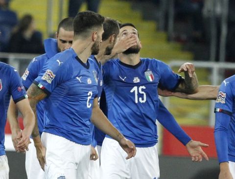 Italy's Cristiano Biraghi, center, celebrate with his teammate after scoring the winning goal during the UEFA Nations League soccer match between Poland and Italy at the Silesian Stadium Chorzow, Poland, Sunday Oct. 14, 2018. Italy won 1.0. (AP Photo/Czarek Sokolowski)