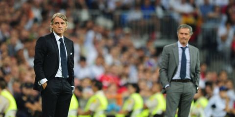 Real Madrid's Coach Jose Mourinho and Manchester City's Roberto Mancini