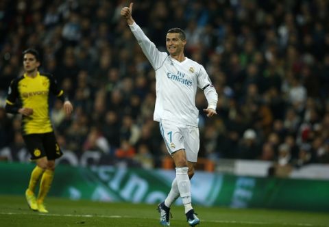 Real Madrid's Cristiano Ronaldo celebrates after he scored his side's second goal during the Champions League Group H soccer match between Real Madrid and Borussia Dortmund at the Santiago Bernabeu stadium in Madrid, Spain, Wednesday, Dec. 6, 2017. (AP Photo/Paul White)