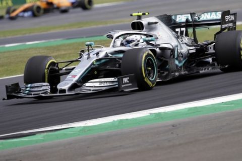 Mercedes driver Valtteri Bottas of Finland steers his car during the second free practice at the Silverstone racetrack, in Silverstone, England, Friday, July 12, 2019. The British Formula One Grand Prix will be held on Sunday. (AP Photo/Luca Bruno)