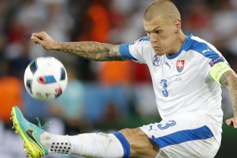 Slovakia's Martin Skrtel goes for the ball during the Euro 2016 Group B soccer match between Slovakia and England at the Geoffroy Guichard stadium in Saint-Etienne, France, Monday, June 20, 2016. (AP Photo/Laurent Cipriani)