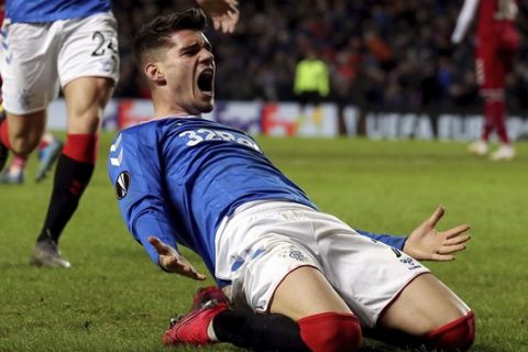 Rangers Ianis Hagi celebrates scoring his side's third goal of the game during the Europa League round of 32 first leg soccer match between Rangers and Sporting Braga at Ibrox Stadium, Glasgow, Scotland, Thursday, Feb. 20, 2020. (Andrew Milligan/PA via AP)