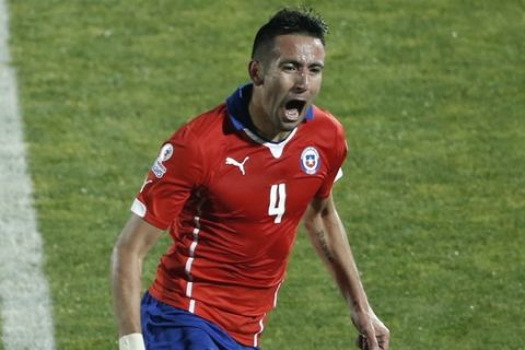 Chile's Mauricio Isla celebrates after scoring against Uruguay  during a Copa America quarterfinal soccer match at the National Stadium in Santiago, Chile, Wednesday, June 24, 2015. (AP Photo/Silvia Izquierdo)