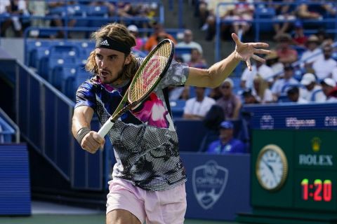 Stefanos Tsitsipas, of Greece, plays during the Western & Southern Open tennis tournament Friday, Aug. 19, 2022, in Mason, Ohio. (AP Photo/Jeff Dean)