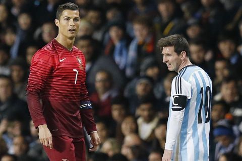 FILE - In this file photo dated Tuesday Nov. 18, 2014, Cristiano Ronaldo of Portugal, left, and Lionel Messi of Argentina, during their International Friendly soccer match at Old Trafford Stadium, Manchester, England. More worldwide soccer tournaments involving even more national teams could be coming to every odd-numbered year from 2021, according to officials of the UEFA-led Global Nations League project, Friday Nov. 3, 2017, which may replace the Confederation Cup, so the worlds best players may face off against each other at last.   (AP Photo/Jon Super, FILE)