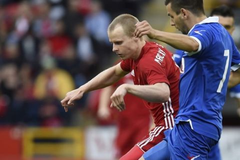 Aberdeen's Gary Mackay-Steven is tackled by Siroki Brijeg's Dino Coric, right, during their Europa League Second Qualifying Round, First Leg soccer match at the Pittodrie Stadium, Aberdeen. Scotland, Thursday, July 13, 2017. (Ian Rutherford/PA via AP)