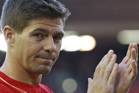Liverpool's Steven Gerrard acknowledges the crowd after the English Premier League soccer match between Liverpool and Crystal Palace at Anfield Stadium, Liverpool, England, Saturday, May 16, 2015. Gerard played his final home match for Liverpool on Saturday at Anfield after over 700 appearances for the club, before he moves to MLS team LA Galaxy. (AP Photo/Jon Super)    