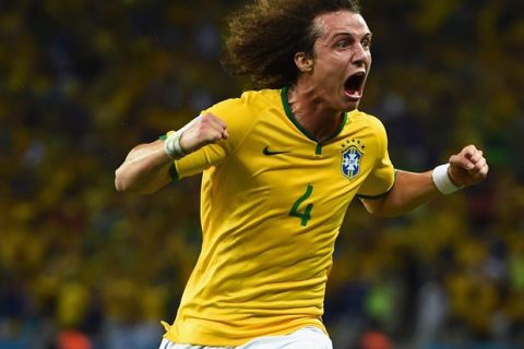 FORTALEZA, BRAZIL - JULY 04:  David Luiz of Brazil celebrates scoring his team's second goal on a free kick during the 2014 FIFA World Cup Brazil Quarter Final match between Brazil and Colombia at Castelao on July 4, 2014 in Fortaleza, Brazil.  (Photo by Laurence Griffiths/Getty Images)