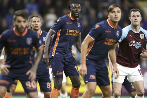 Istanbul Basaksehir's Emmanuel Adebayor, centre, during the match against Burnley during their Europa League, Third Qualifying Round match at Turf Moor in Burnley, England, Thursday Aug. 16, 2018. (Nick Potts/PA via AP)