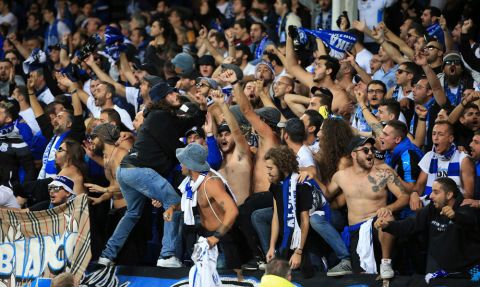 Apollon Limassol soccer fans cheer their team during the game against Everton during the Europa League, Group E soccer match at Goodison Park, Liverpool, England, Thursday Sept. 28, 2017. (Peter Byrne/PA via AP)