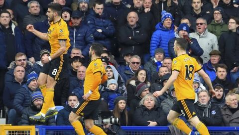 Wolverhampton Wanderers' Ruben Neves celebrates scoring his side's first goal of the game from a penalty during the  English Premier League soccer match between Everton and Wolverhampton Wanderers at Goodison Park, in Liverpool, England, Saturday, Feb. 2, 2019. (Peter Byrne/PA via AP)