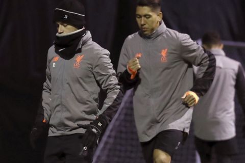Liverpool's Philippe Coutinho, left, and Roberto Firmino during a training session at Melwood Training Ground in Liverpool, England, Tuesday Dec. 5, 2017.  Liverpool play Spartak Moscow in a Champions League soccer match Wednesday. (Nick Potts/PA via AP)