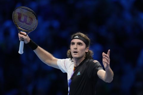 Greece's Stefanos Tsitsipas celebrates after winning against Russia's Daniil Medvedev during their singles tennis match of the ATP World Tour Finals, at the Pala Alpitour in Turin, Italy, Wednesday, Nov. 16, 2022. (AP Photo/Antonio Calanni)