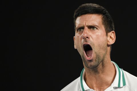 Serbia's Novak Djokovic celebrates after winning the second set against Russia's Aslan Karatsev during their semifinal match at the Australian Open tennis championship in Melbourne, Australia, Thursday, Feb. 18, 2021.(AP Photo/Andy Brownbill)