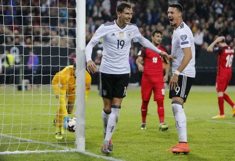 Germany's Leon Goretzka, center, celebrates after scoring his side's fourth goal during the 2018 World Cup qualifying Group C soccer match between Germany and Azerbaijan in Kaiserslautern, Germany, Sunday, Oct. 8, 2017.(AP Photo/Michael Probst)