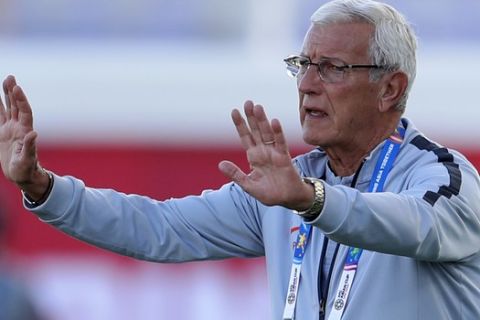 China's head coach Marcello Lippi gives instructions from the side line during the AFC Asian Cup group C soccer match between China and Kyrgyzstan at the Khalifa bin Zayed Stadium in Al Ain, United Arab Emirates, Monday, Jan. 7, 2019. (AP Photo/Hassan Ammar)