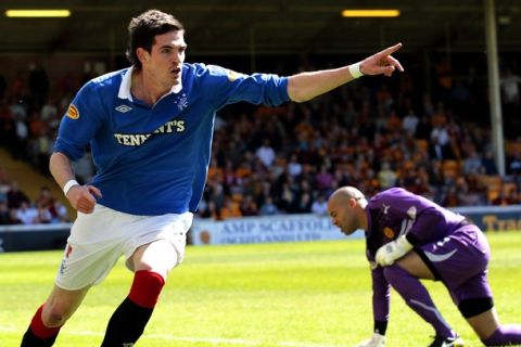 Rangers' Kyle Lafferty celebrates scoring against Motherwell during their Scottish Premier League soccer match at Firhill Stadium in Motherwell, Scotland April 30, 2011. REUTERS/David Moir (BRITAIN - Tags: SPORT SOCCER)