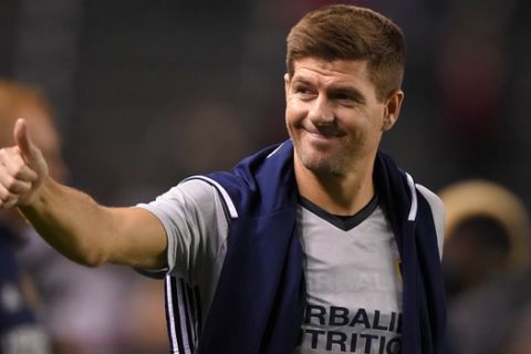 FILE - In this Feb. 9, 2016, file photo, Los Angeles Galaxy midfielder Steven Gerrard, of England, gestures to fans after a soccer match against Club Tijuana, in Carson, Calif. Gerrard is leaving the LA Galaxy after two seasons, and the former England midfielder is still considering what to do next. (AP Photo/Mark J. Terrill, File)