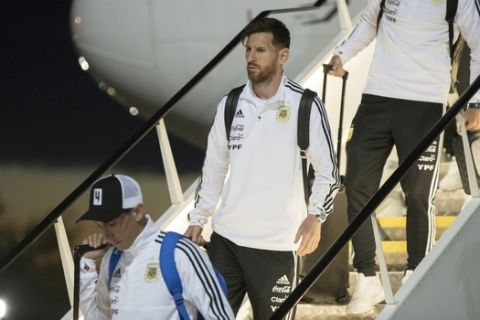 Lionel Messi, center, and his teammates disembark the plane as Argentina national soccer team arrive at Zhukovsky international airport outside Moscow, Russia, Saturday, June 9, 2018 to compete in the 2018 World Cup in Russia. The 21st World Cup begins on Thursday, June 14, 2018, when host Russia takes on Saudi Arabia. (AP Photo/Pavel Golovkin)
