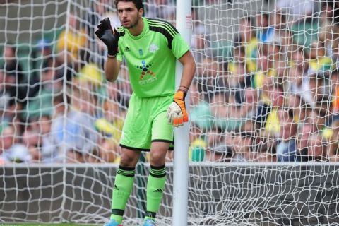 NORWICH, ENGLAND - AUGUST 10:  Stefanos Kampino of Panathinaikos in action during the pre-season friendly match between Norwich City and Panathinaikos at Carrow Road on August 10, 2013 in Norwich, England.  (Photo by Jamie McDonald/Getty Images)