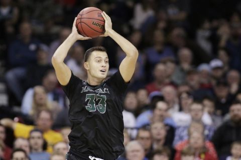 Hawaii forward Stefan Jankovic (33) looks to pass during the first half of a first-round men's college basketball game against California in the NCAA Tournament in Spokane, Wash., Friday, March 18, 2016. (AP Photo/Young Kwak)
