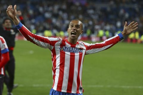 Atletico de Madrid's Joao Miranda from Brazil celebrates after winning the Copa del Rey final soccer match against Real Madrid at the Santiago Bernabeu stadium in Madrid, Spain, Friday, May 17, 2013. (AP Photo/Andres Kudacki)