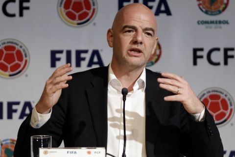 FIFA President Gianni Infantino gestures during a press conference at the Soccer Federation headquarters in Bogota, Colombia, Thursday, March 31, 2016. Infantino is on a two-day official visit to Colombia. (AP Photo/Fernando Vergara)
