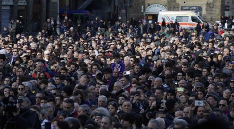 People attend the funeral ceremony of Italian player Davide Astori in Florence, Italy, Thursday, March 8, 2018. The 31-year-old Astori was found dead in his hotel room on Sunday after a suspected cardiac arrest before his team was set to play an Italian league match at Udinese. (AP Photo/Alessandra Tarantino)