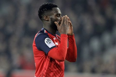 Lille's Jonathan Bamba reacts during the French League One soccer match between Lille and Monaco at the Lille Metropole stadium, in Villeneuve d'Ascq, northern France, Friday, March 15, 2019. (AP Photo/Michel Spingler)