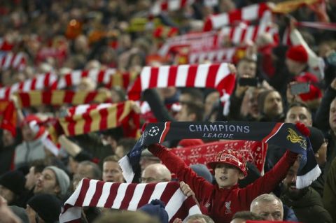 Soccer fans cheer during the Champions League Group C soccer match between Liverpool and Napoli at Anfield stadium in Liverpool, England, Tuesday, Dec. 11, 2018.(AP Photo/Dave Thompson)