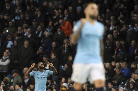 Manchester City's Raheem Sterling, left, celebrates after scoring his side's second goal during the English Premier League soccer match between Manchester City and Bournemouth at Etihad stadium in Manchester, England, Saturday, Dec. 1, 2018. (AP Photo/Rui Vieira)