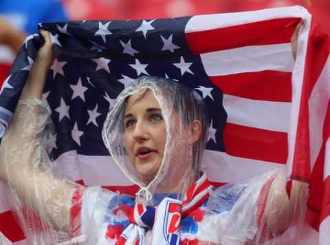RECIFE, BRAZIL - JUNE 26:  An United States fan looks on in the rain prior to the 2014 FIFA World Cup Brazil group G match between the United States and Germany at Arena Pernambuco on June 26, 2014 in Recife, Brazil.  (Photo by Martin Rose/Getty Images)