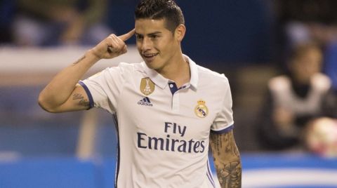Real Madrid's James Rodriguez reacts after scoring a goal during a Spanish La Liga soccer match between Deportivo La Coruna and Real Madrid at the Riazor stadium in A Coruna, Spain, Wednesday April 26, 2017. (AP Photo/Lalo R. Villar)