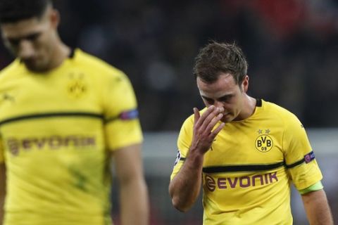 Dortmund midfielder Mario Gotze, right, reacts after losing the Champions League round of 16, first leg, soccer match between Tottenham Hotspur and Borussia Dortmund at Wembley stadium in London, England, Wednesday, Feb. 13, 2019. (AP Photo/Frank Augstein)
