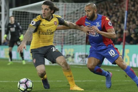 Arsenal's Hector Bellerin, left, competes for the ball with Crystal Palace's Andros Townsend during the English Premier League soccer match between Crystal Palace and Arsenal at Selhurst Park in London, Monday April 10, 2017. (AP Photo/Tim Ireland)