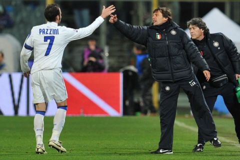 Inter Milan's midfielder Giampaolo Pazzini (L) celebrates with Inter Milan's Brazilian coach Leonardo (C) after scoring against Fiorentina during their Italian serie A football match at the Artemio Franchi stadium in Florence on February 16, 2011.  AFP PHOTO / ALBERTO PIZZOLI (Photo credit should read ALBERTO PIZZOLI/AFP/Getty Images)