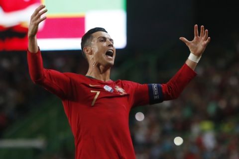 Portugal's Cristiano Ronaldo celebrates after scoring his side's second goal during the Euro 2020 group B qualifying soccer match between Portugal and Luxembourg at the Jose Alvalade stadium in Lisbon, Friday, Oct 11, 2019. (AP Photo/Armando Franca)