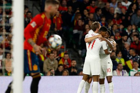 England's Marcus Rashford (11) celebrates after scoring his side's second with Raheem Sterling, right, and Hary Kane during the UEFA Nations League soccer match between Spain and England at Benito Villamarin stadium, in Seville, Spain, Monday, Oct. 15, 2018. (AP Photo/Miguel Morenatti)