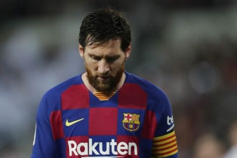 Barcelona's Lionel Messi reacts during the Spanish La Liga soccer match between Real Madrid and Barcelona at the Santiago Bernabeu stadium in Madrid, Spain, Sunday, March 1, 2020. (AP Photo/Manu Fernandez)