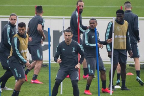 Juventus' Cristiano Ronaldo, foreground, and teammates during a training session in Turin, Italy, Tuesday, Feb. 25, 2020. Juventus will play Lyon in a Champions League, round of 16th, first leg match, in France Wednesday. (Marco Alpozzi/LaPresse via AP)