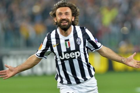 Juventus midfielder Andrea Pirlo  celebrates after scoring during the Europa League quarterfinal soccer match between Juventus and Olympic Lyon at the Juventus stadium, in Turin, Italy, Thursday, April 10, 2014. (AP Photo/ Massimo Pinca)
