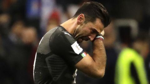 Italy goalkeeper Gianluigi Buffon cries after his team got eliminated in the World Cup qualifying play-off second leg soccer match between Italy and Sweden, at the Milan San Siro stadium, Italy, Monday, Nov. 13, 2017. (AP Photo/Luca Bruno)