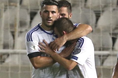 Bosnia's Edin Visca, right, celebrates his goal with his teammate Sead Kolasinac against Cyprus during their World Cup Group H qualifying soccer match between Cyprus and Bosnia-Herzegovina, at GSP stadium, in Nicosia, Cyprus, Thursday, Aug. 31, 2017. (AP Photo/Petros Karadjias)