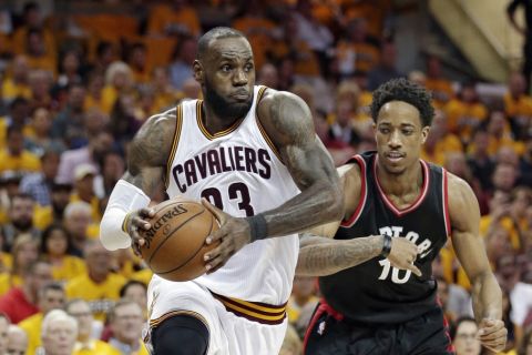 Cleveland Cavaliers' LeBron James (23) drives past Toronto Raptors' DeMar DeRozan (10) in the second half in Game 1 of a second-round NBA basketball playoff series, Monday, May 1, 2017, in Cleveland. The Cavaliers won 116-105. (AP Photo/Tony Dejak)