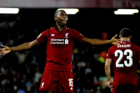 Liverpool's Daniel Sturridge, left, celebrates after scoring his side's opening goal during the English League Cup soccer match between Liverpool and Chelsea at Anfield stadium in Liverpool, England, Wednesday, Sept. 26, 2018. (AP Photo/Rui Vieira)