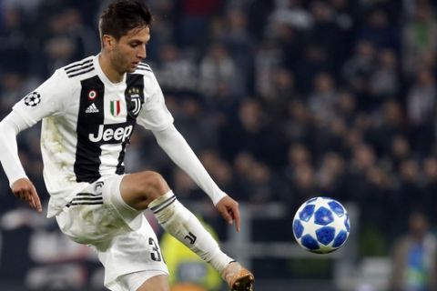 Juventus midfielder Rodrigo Bentancur reaches for the ball during the Champions League group H soccer match between Juventus and Manchester United at the Allianz stadium in Turin, Italy, Wednesday, Nov. 7, 2018. (AP Photo/Antonio Calanni)