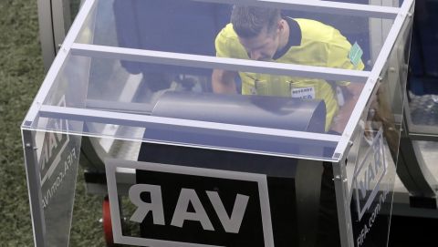 Referee Matt Conger from New Zealand watches the Video Assistant Referee system, known as VAR during the group D match between Nigeria and Iceland at the 2018 soccer World Cup in the Volgograd Arena in Volgograd, Russia, Friday, June 22, 2018. (AP Photo/Themba Hadebe)
