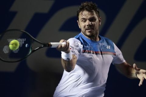 Switzerland's Stan Wawrinka hits a forehand to Bulgaria's Grigor Dimitrov in the quarterfinals of the Mexican Open tennis tournament in Acapulco, Mexico, Thursday, Feb. 27, 2020. (AP Photo/Rebecca Blackwell)